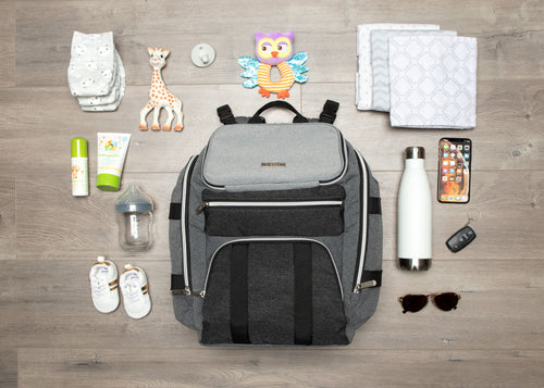 The Enzo baby bag surrounded by items that can fit in the bag - product thumbnail