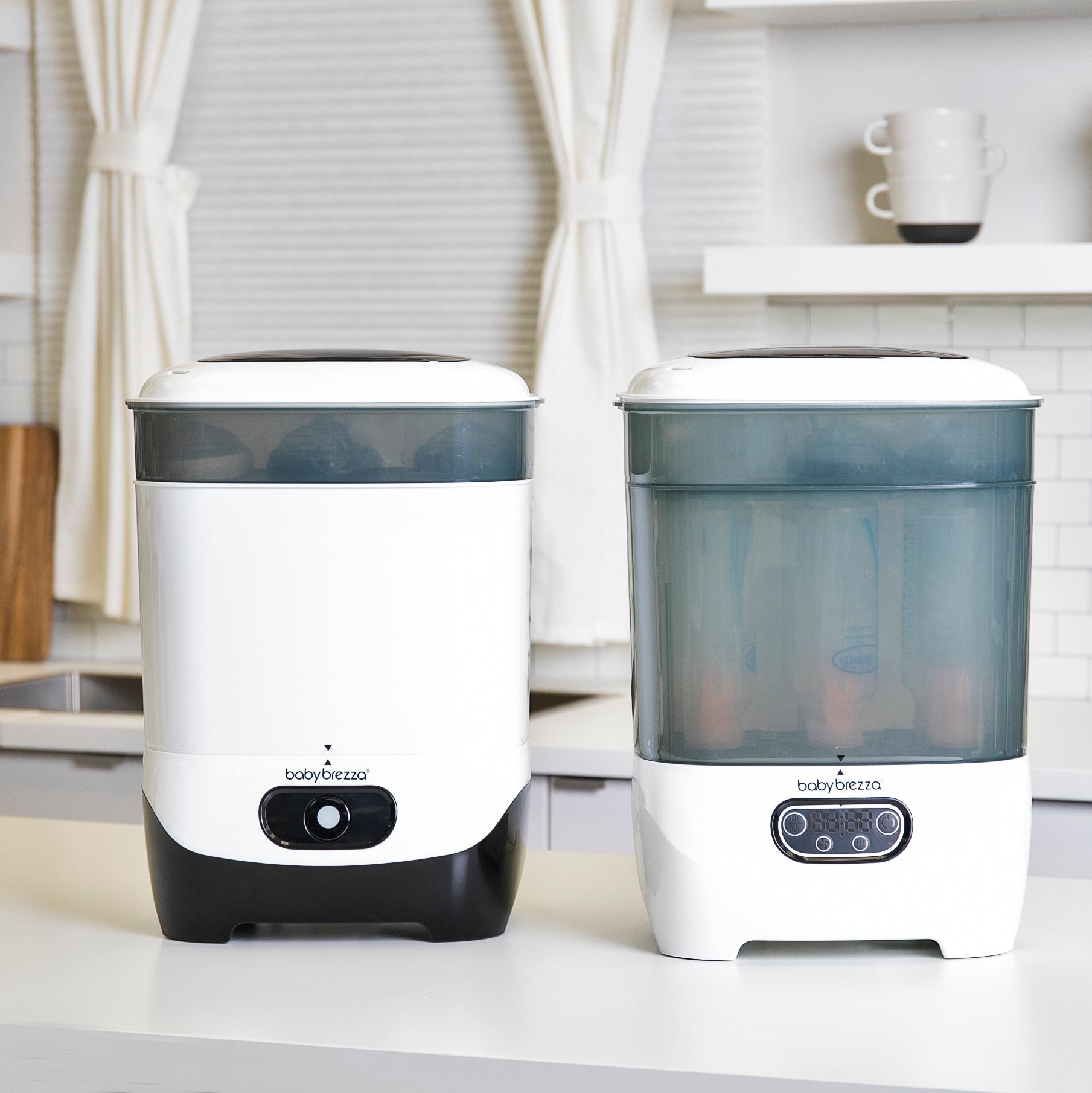 Woman using our One Step Sterilizer Dryer Advanced to Sanitize Baby Bottles, Pump Parts and more.