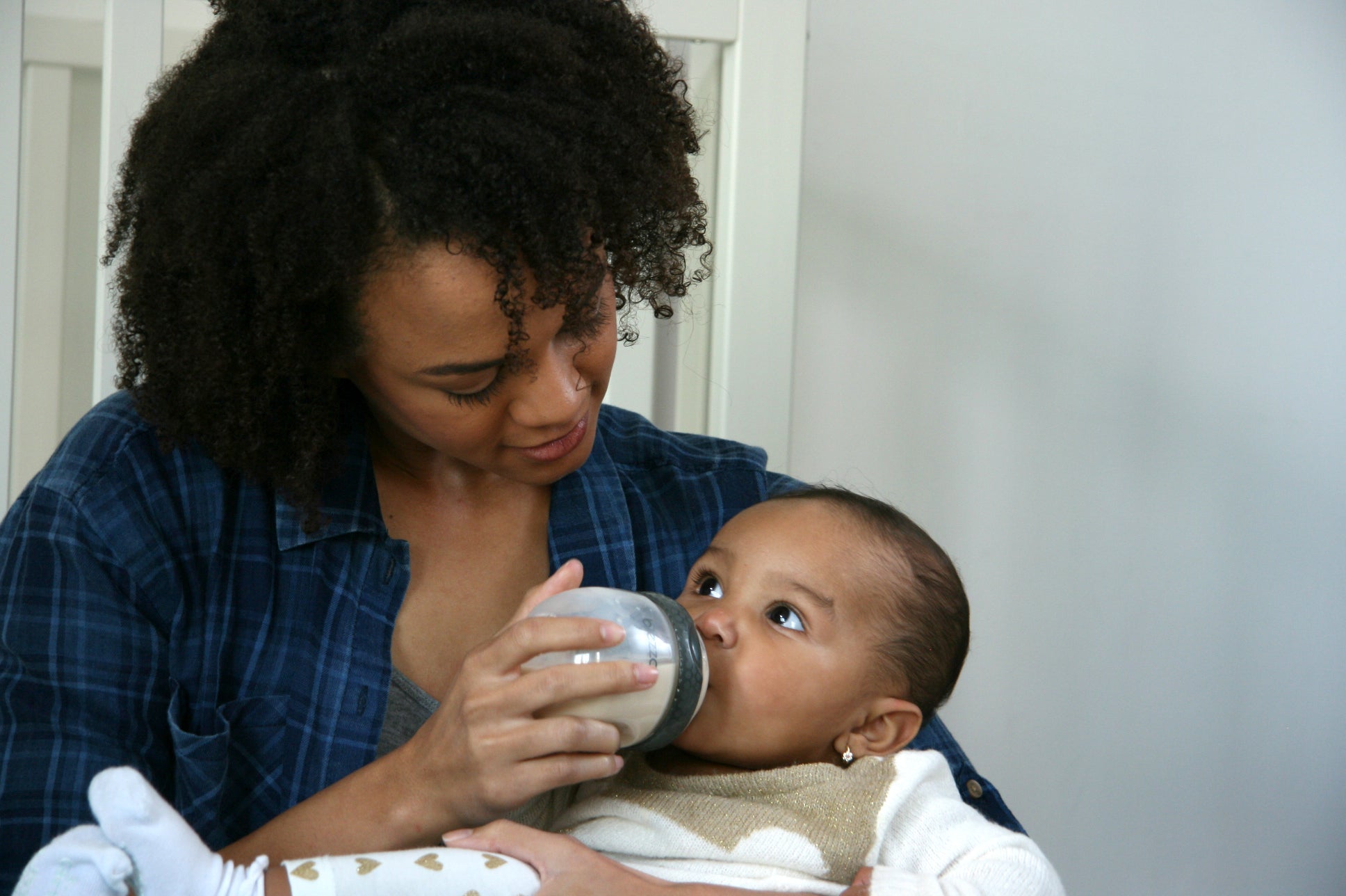 Mother Using a Safely Cleaned Baby Bottle