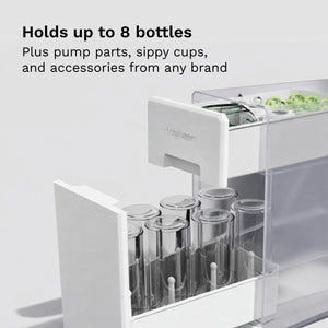 White drying rack drawer with bottles and pump parts on a light gray background, text indicating "Hold up to 8 bottles, plus pump parts, sippy cups, and accessories from any brand