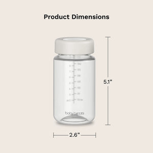 Clear baby bottle with white cap and measurement details on a beige background