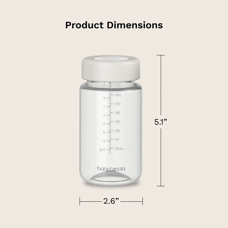 Clear baby bottle with white cap and measurement details on a beige background