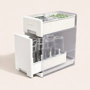 Baby bottle covered drying rack and organizer with clear protective lid, holding up to 8 bottles, pump parts and accessories on a compact countertop.