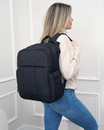 Woman wearing the Gio sporty diaper backpack - product thumbnail