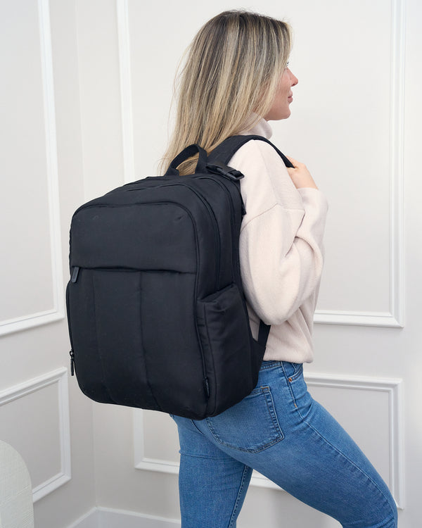 Woman wearing the Gio sporty diaper backpack - product thumbnail