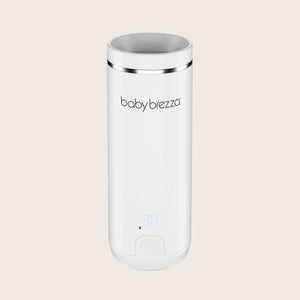 white baby brezza superfast portable travel bottle warmer with digital display on a beige background