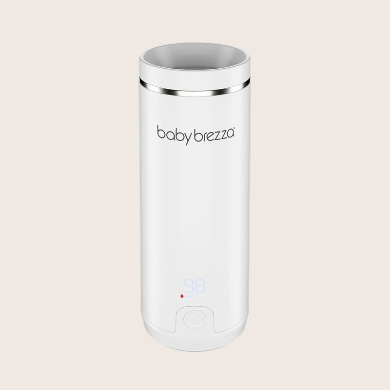 white baby brezza superfast portable travel bottle warmer with digital display on a beige background