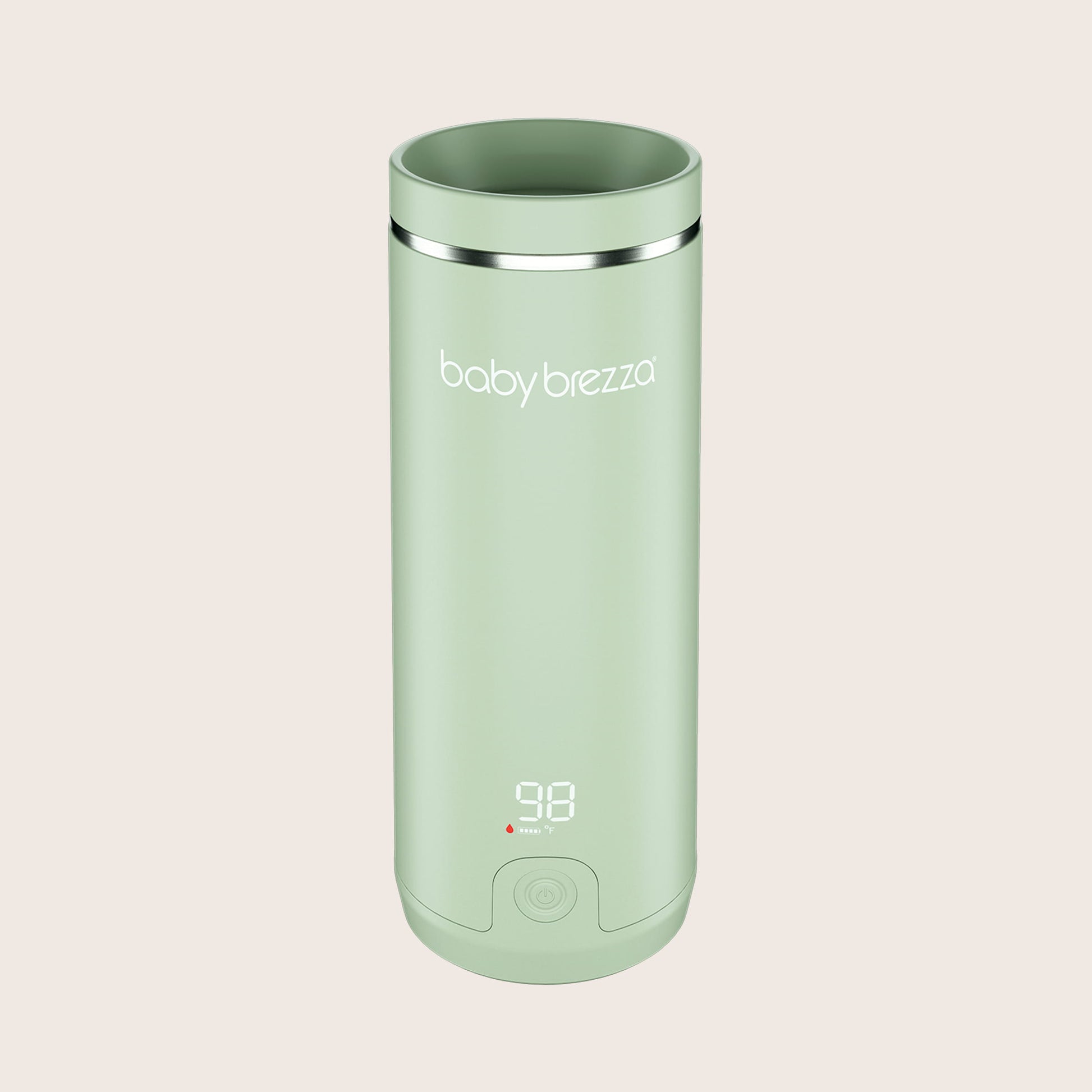 green baby brezza superfast portable travel bottle warmer with digital display on a beige background