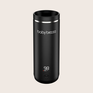 Black baby brezza superfast portable travel breastmilk formula and water warmer with digital display on a beige background