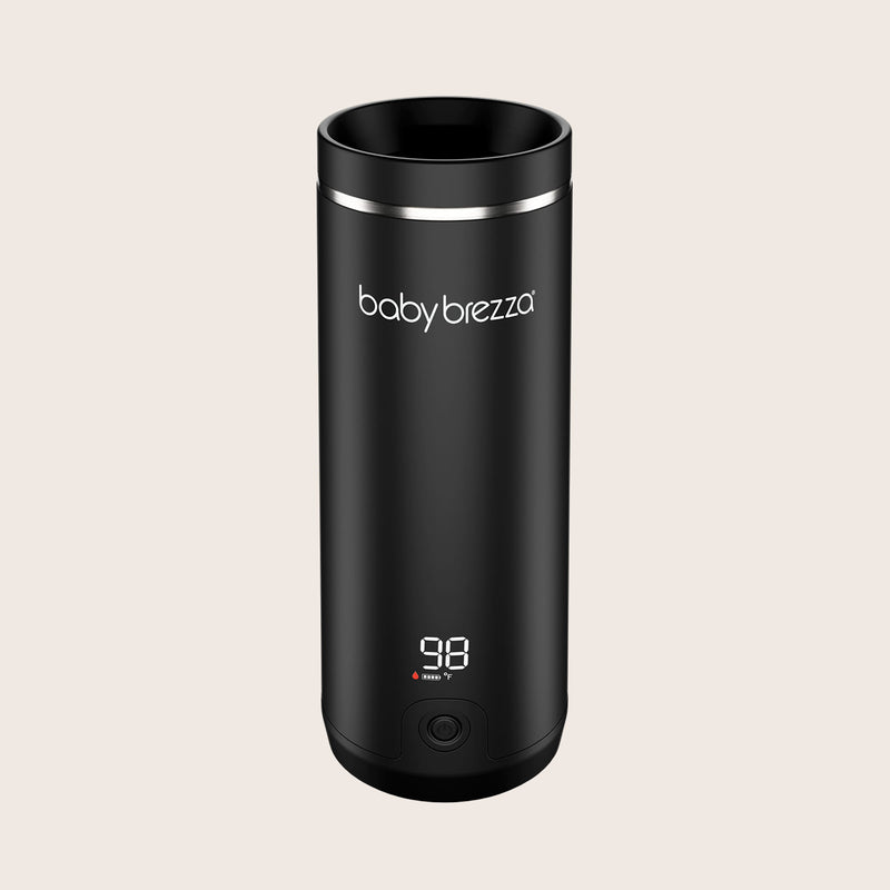Black baby brezza superfast portable travel breastmilk formula and water warmer with digital display on a beige background