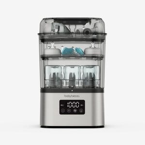 Baby Brezza SuperQuick baby bottle sterilizer and dryer in stainless steel with bottles and pump parts inside