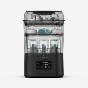 Baby Brezza SuperQuick baby bottle sterilizer and dryer in matte black with bottles and pump parts inside