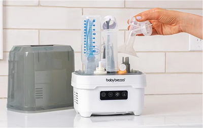 Holds 2 bottles, pump parts, pacifiers, and accessories from any brand