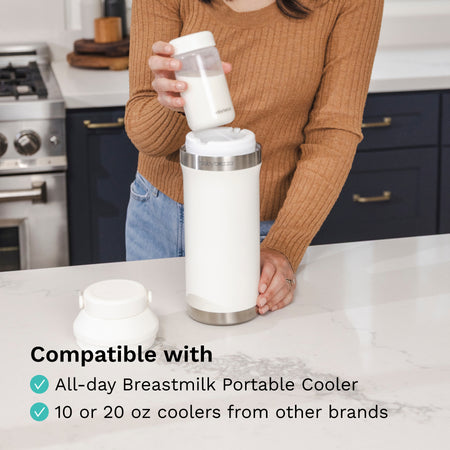 Person using a portable breastmilk cooler in a kitchen setting, text indicating "Compatible with All day Breastmilk Portable Cooler, or 10 or 20 oz. coolers from other brands