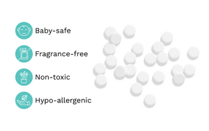 White round tablets scattered on a white background with four teal icons and text listing product benefits: Baby-safe, Fragrance-free, Non-toxic, and Hypo-allergenic.