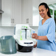 Woman loading the baby bottle washer