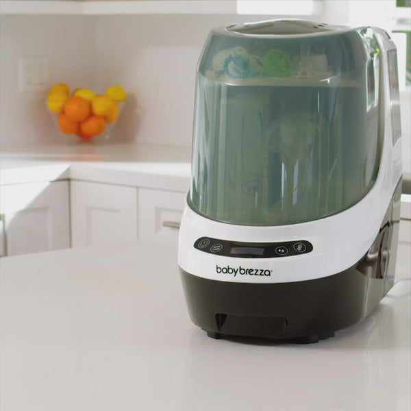 Load video: SuperQuick Baby Bottle Sterilizer and Dryer - Sterilizes &amp; Dries in just 10 Minutes
