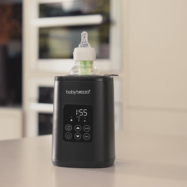 Load video: SuperQuick Baby Bottle Sterilizer and Dryer - Sterilizes &amp; Dries in just 10 Minutes